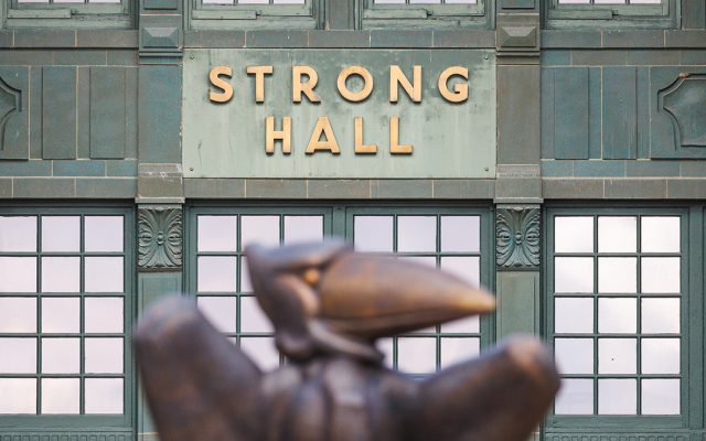Bronze Jayhawk statue in front of Strong Hall