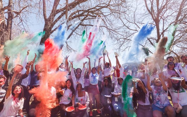 Students throw colored powders in the air to celebrate the Hindu holiday Holi.